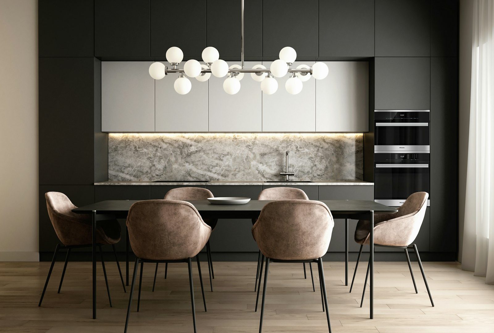 Modern open-plan kitchen and dining interior with dark cabinetry